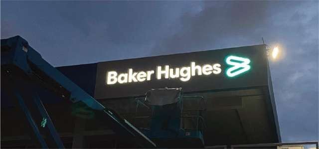 Baker Hughes backlit building signage at dusk — Backlit Signage by Garrison Productions, Singapore