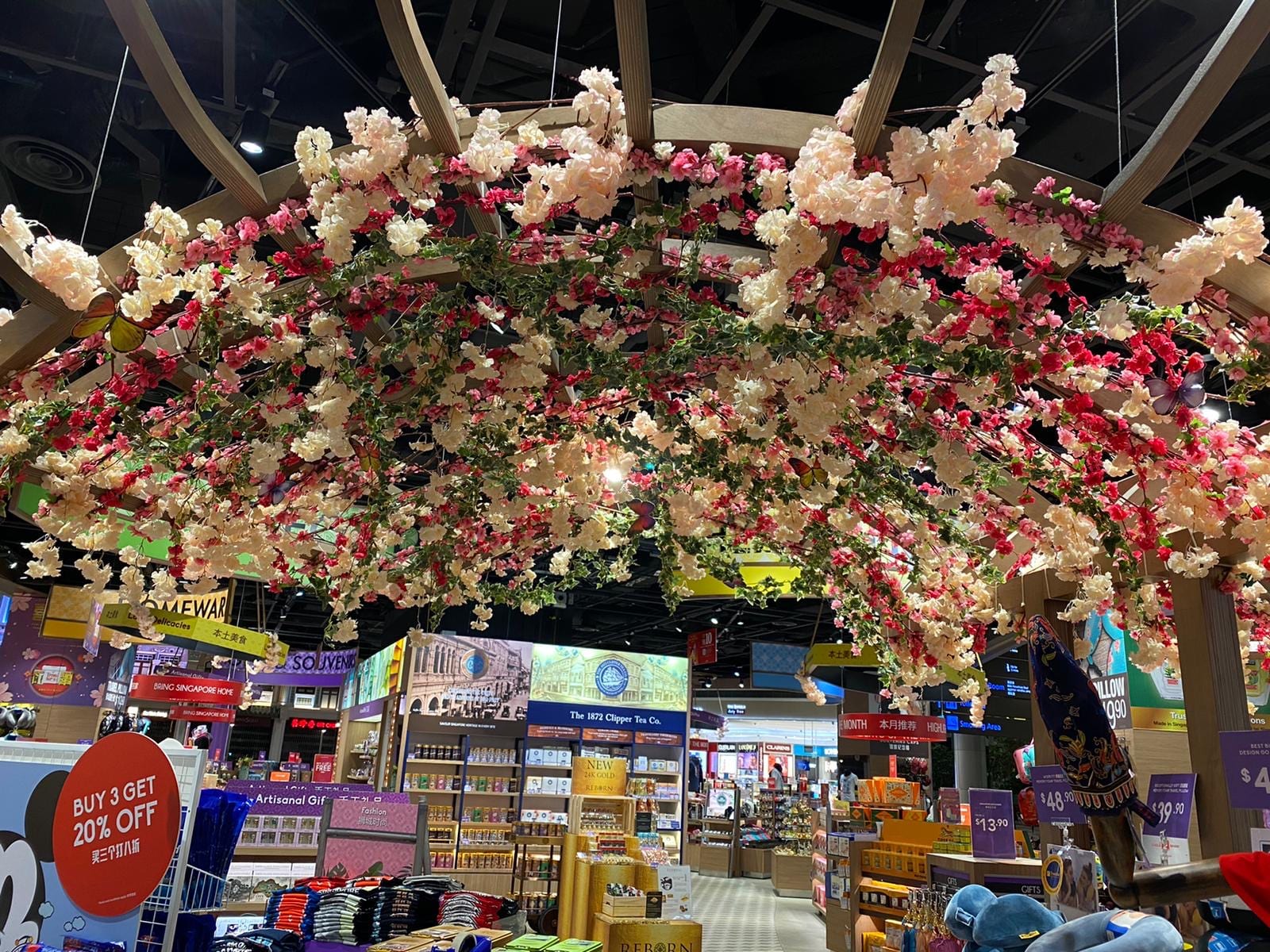 Hanging flower decor over a retail event — Event Backdrop by Garrison Productions, Singapore