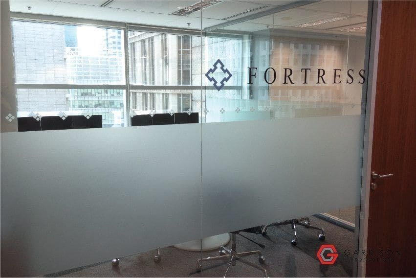 Fortress logo frosted film on a meeting room — frosted sticker in Singapore by Garrison Productions