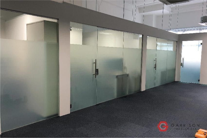 Full-height frosted film on an office partition — Frosted Film by Garrison Productions, Singapore