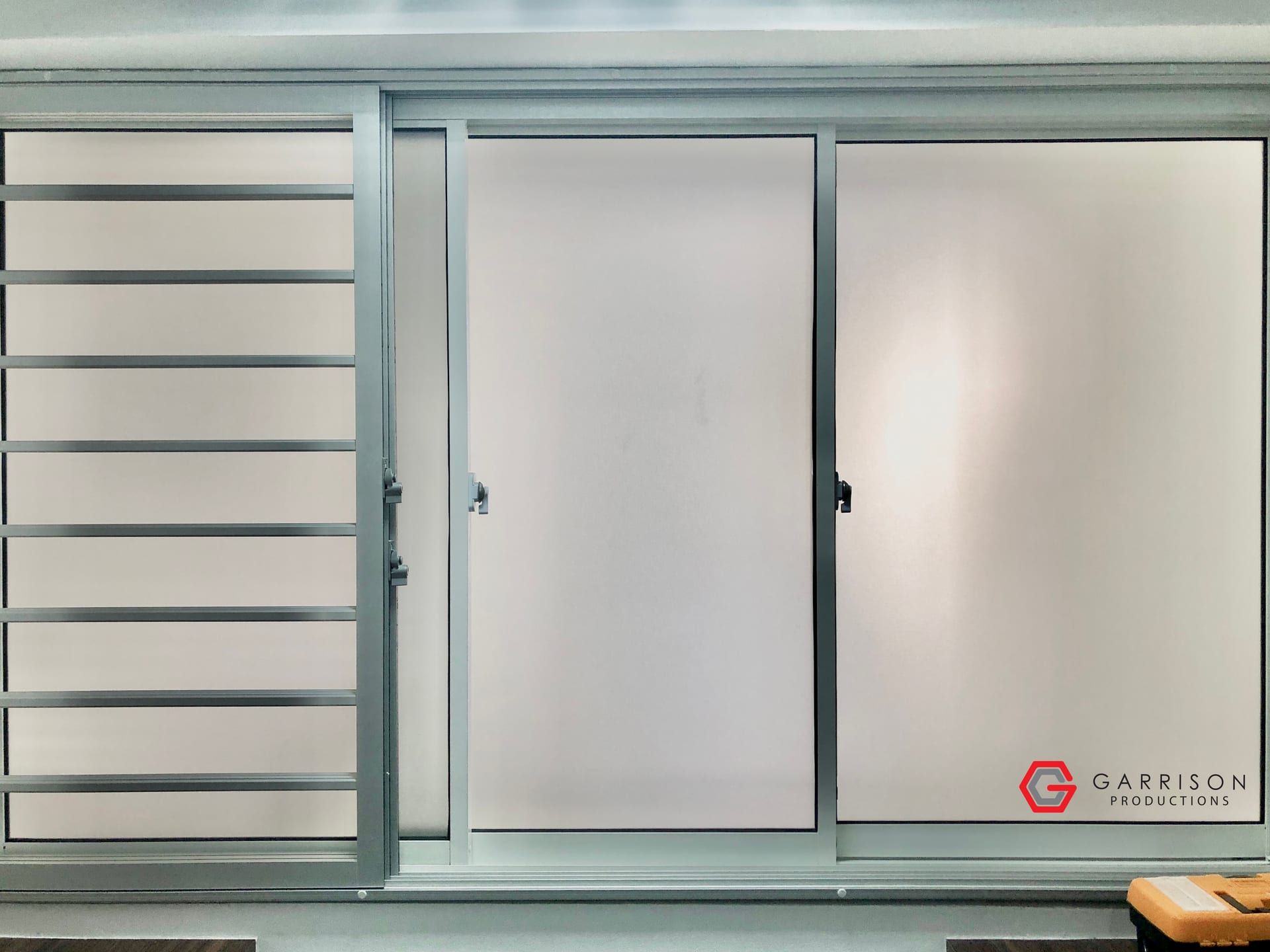 Frosted film on sliding windows — frosted window film in Singapore by Garrison Productions
