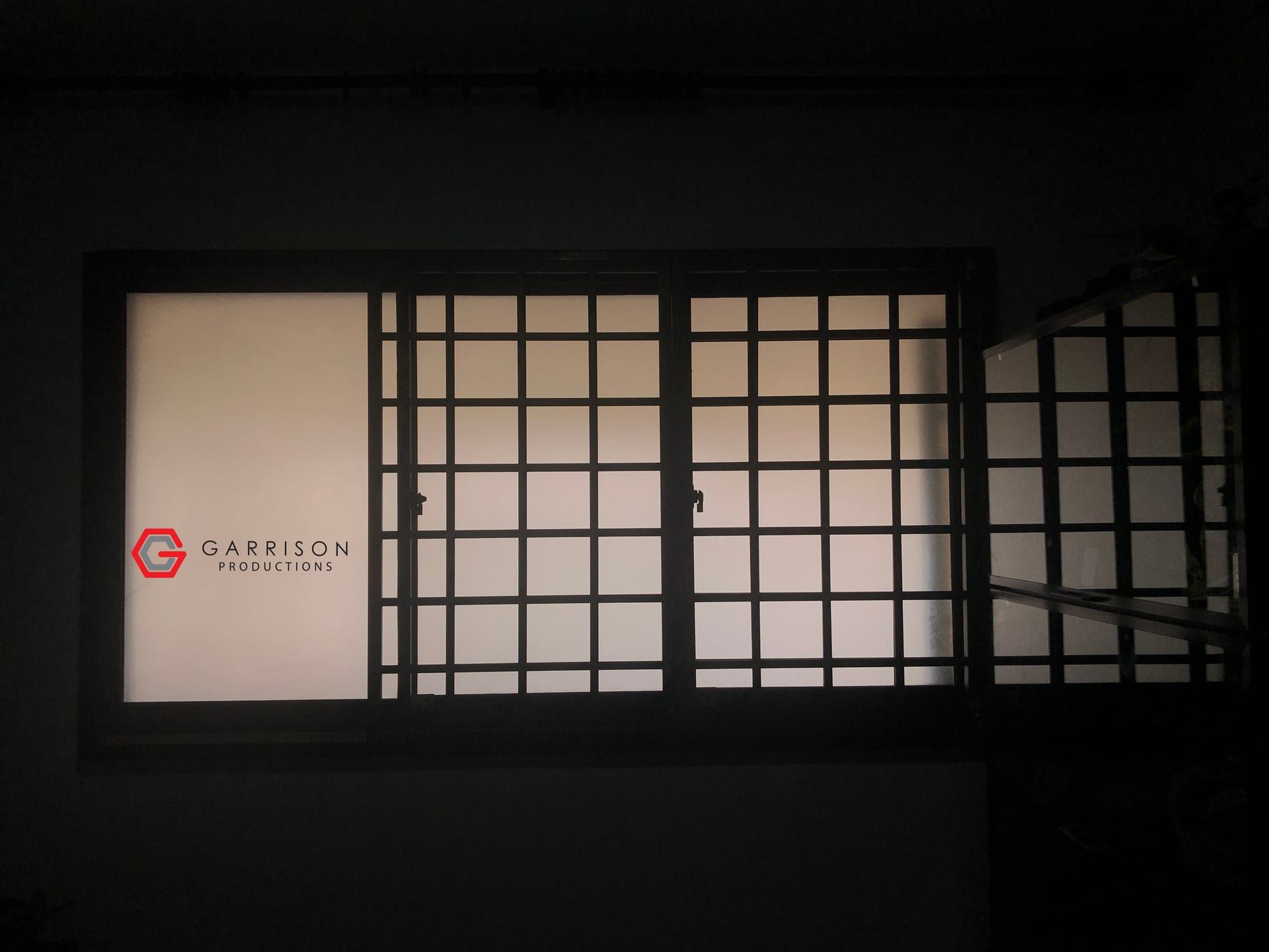 Frosted film on a window behind grilles — Frosted Film by Garrison Productions, Singapore
