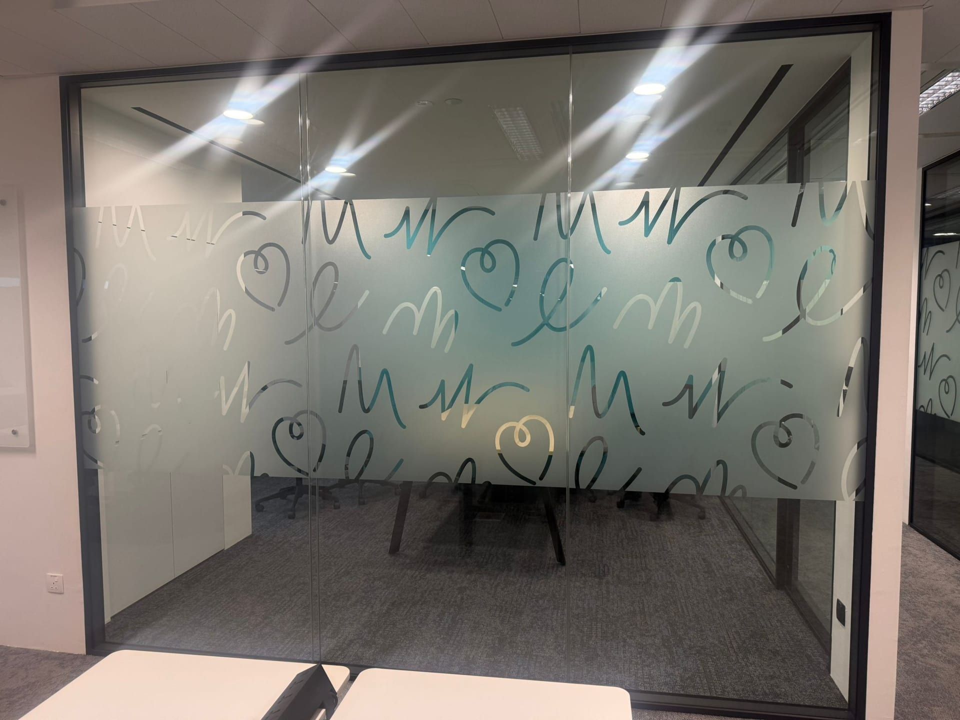 Heart doodle frosted film on a meeting room — Frosted Film by Garrison Productions, Singapore