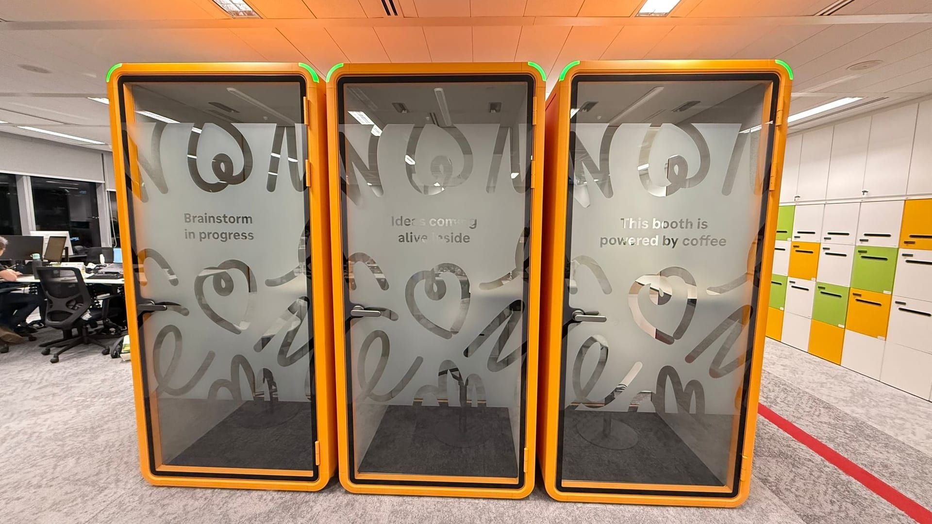 Frosted film on orange office pods — frosted glass sticker design in Singapore by Garrison Productions