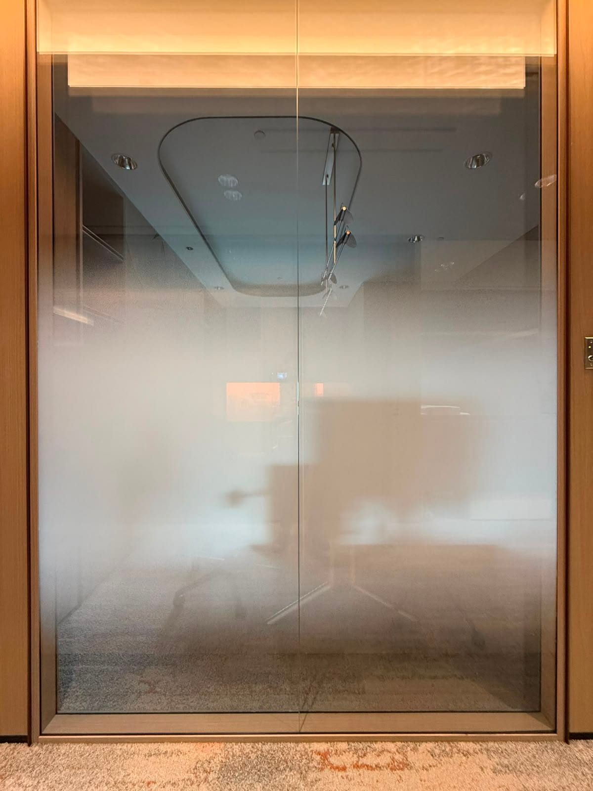 Gradient frosted film on a glass room — frosted window film in Singapore by Garrison Productions