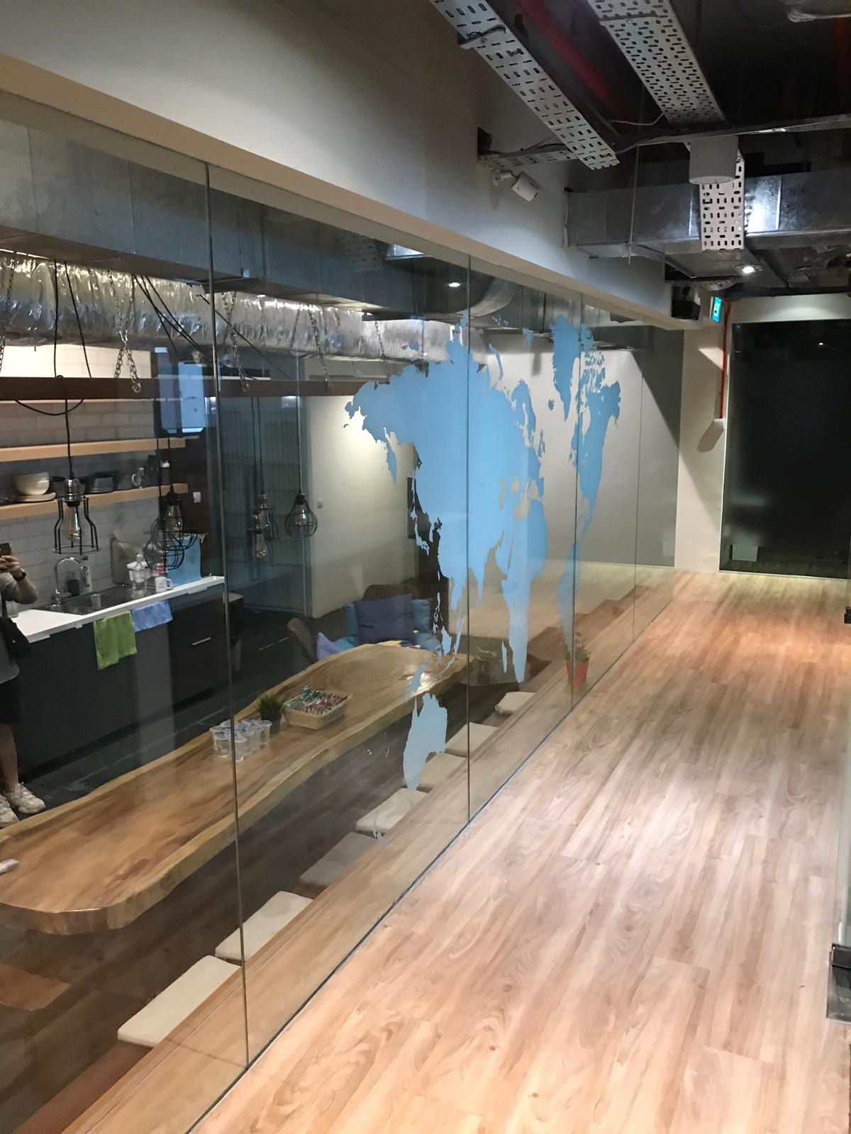 World map frosted film on office glass — frosted window film in Singapore by Garrison Productions