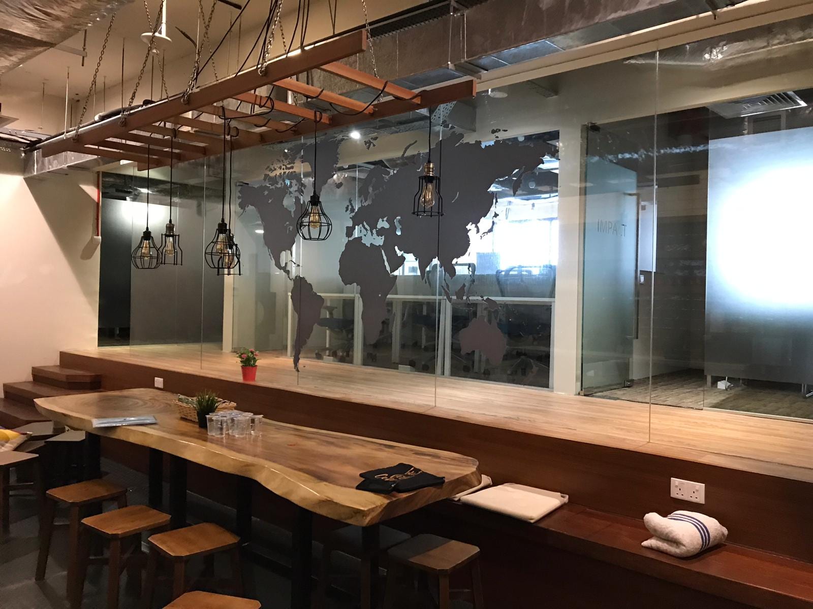 World map frosted film behind a long table — frosted glass sticker in Singapore by Garrison Productions