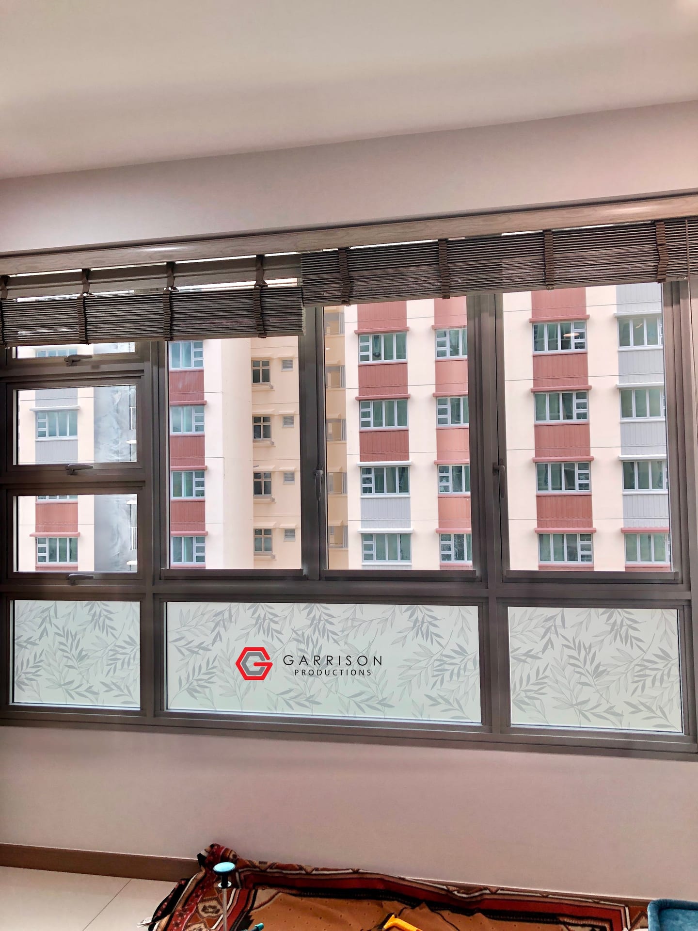 Frosted film on the lower half of HDB windows — frosted window film in Singapore by Garrison Productions