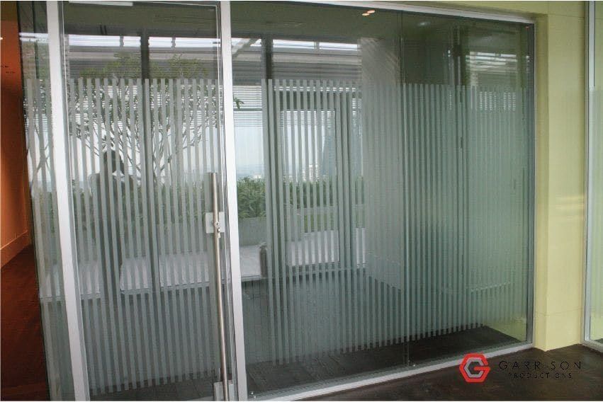 Striped frosted film on glass office doors — frosted sticker for glass door in Singapore by Garrison Productions