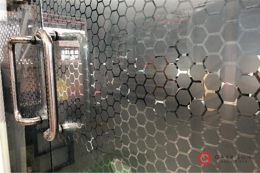 Hexagon-pattern frosted film on a glass door — frosted glass sticker in Singapore by Garrison Productions