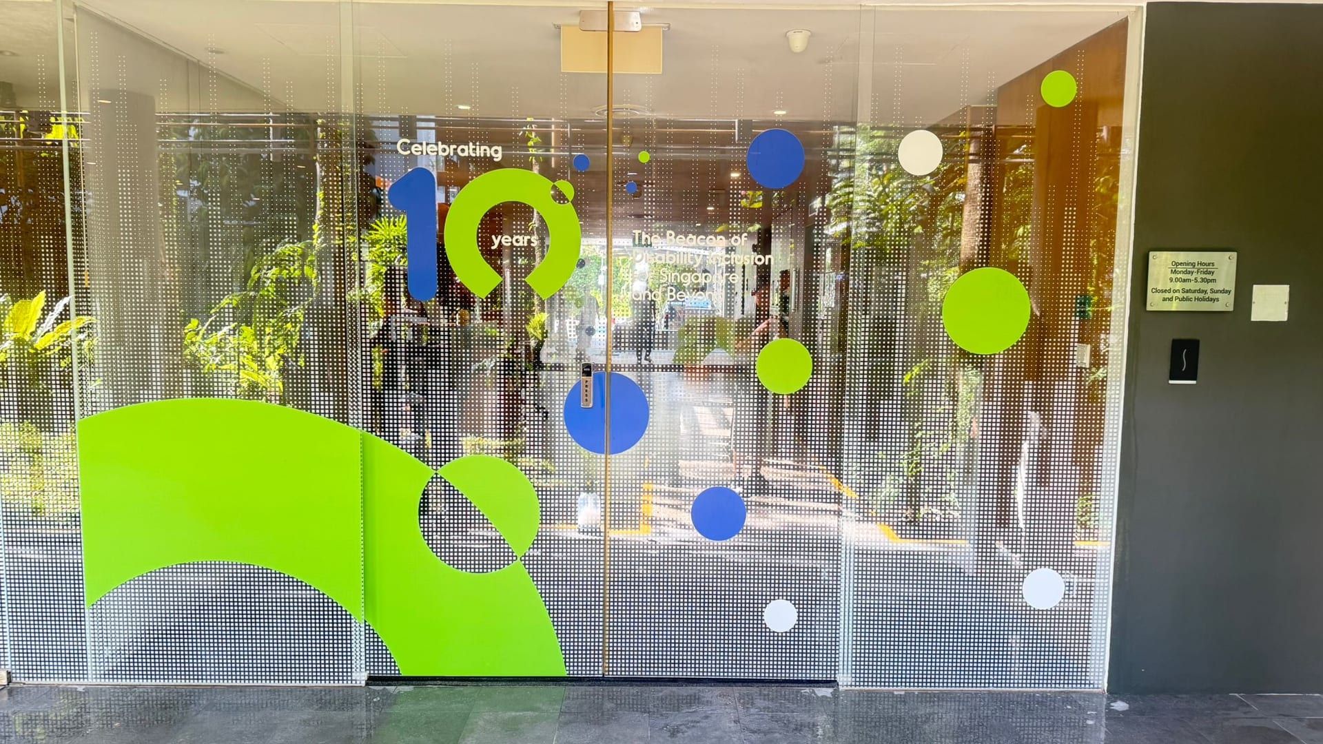 Green dotted glass stickers in an office — Glass Stickers by Garrison Productions, Singapore