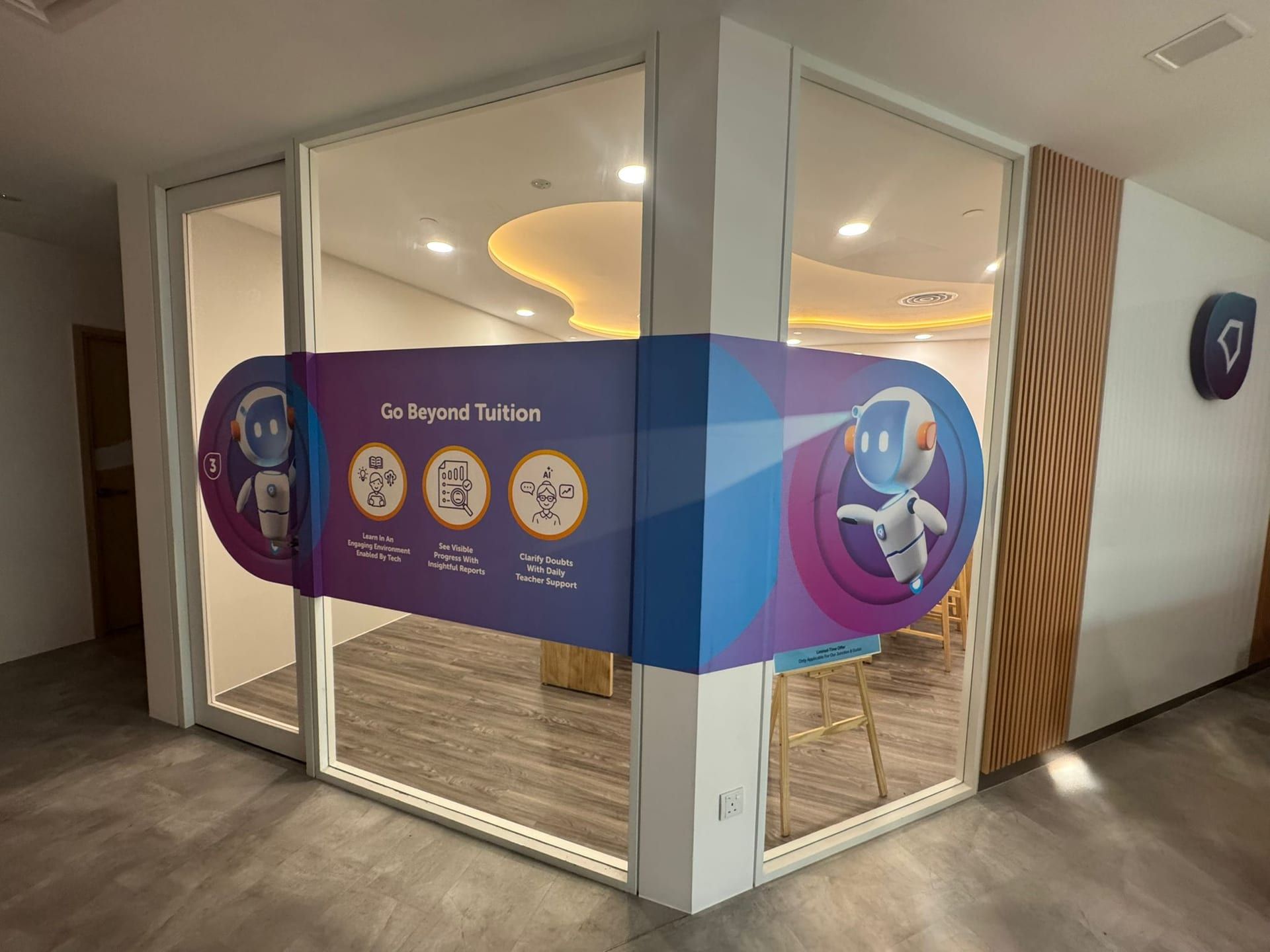 Curved glass sticker panel in an office lobby — Glass Stickers by Garrison Productions, Singapore