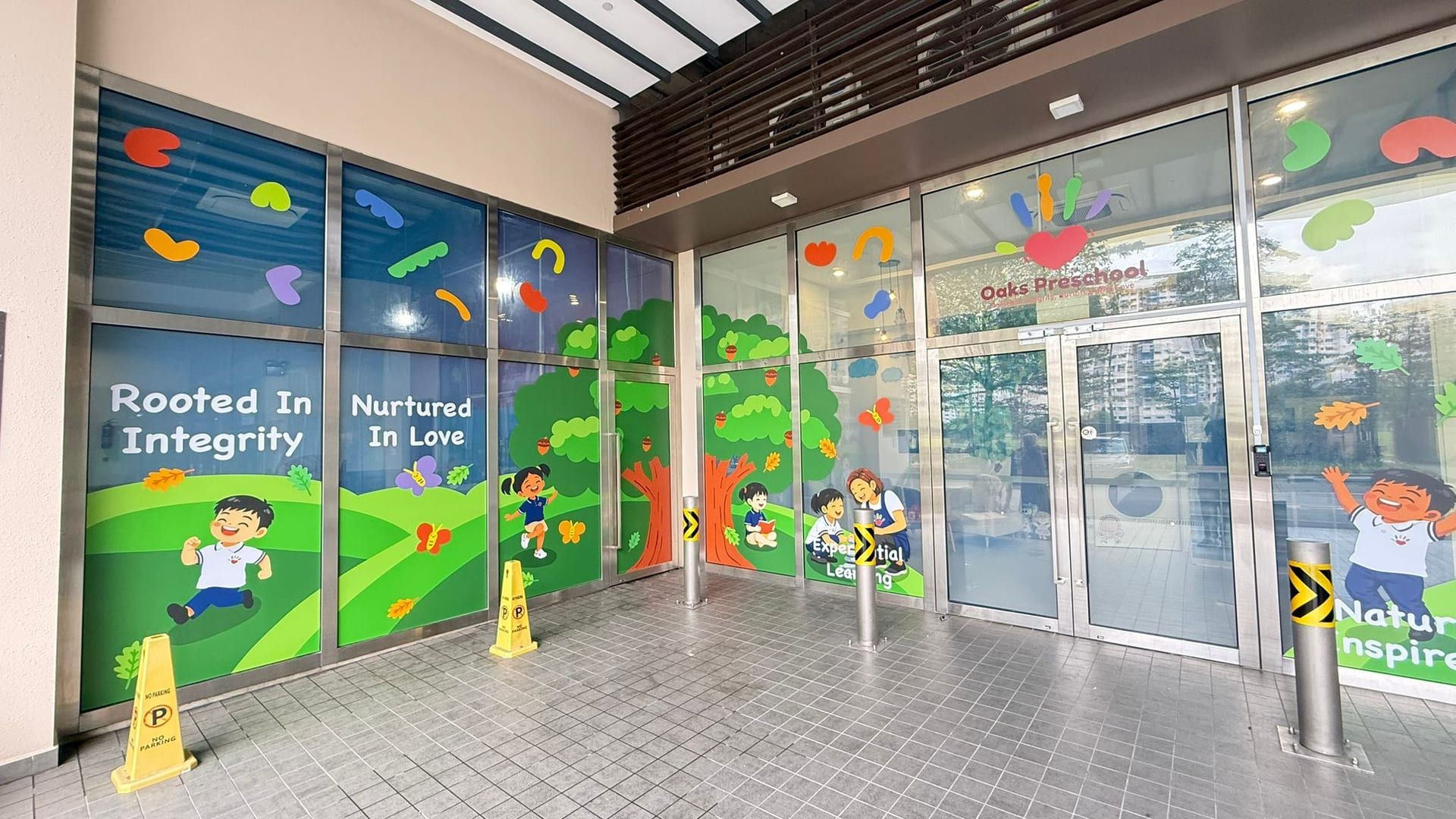 Preschool glass stickers with trees and children — glass sticker design in Singapore by Garrison Productions