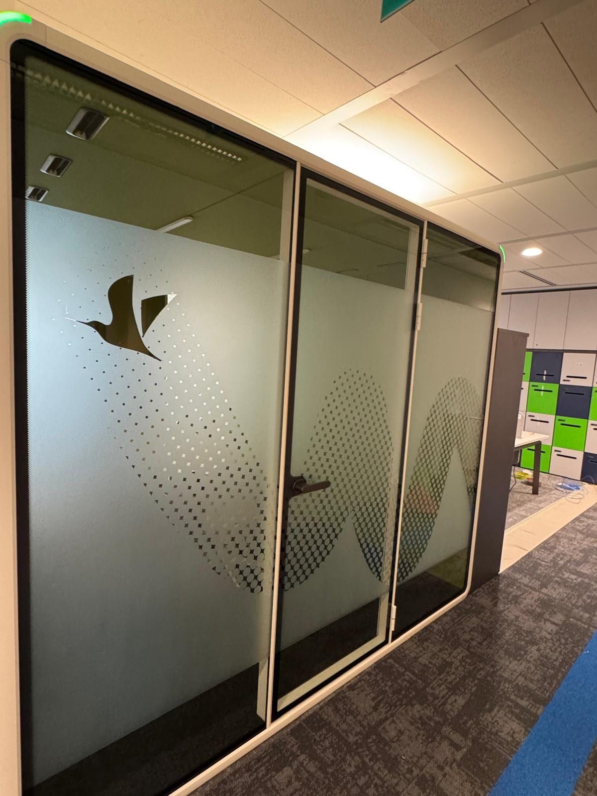 Frosted glass sticker with bird logo on meeting room doors — glass stickers for doors in Singapore by Garrison Productions