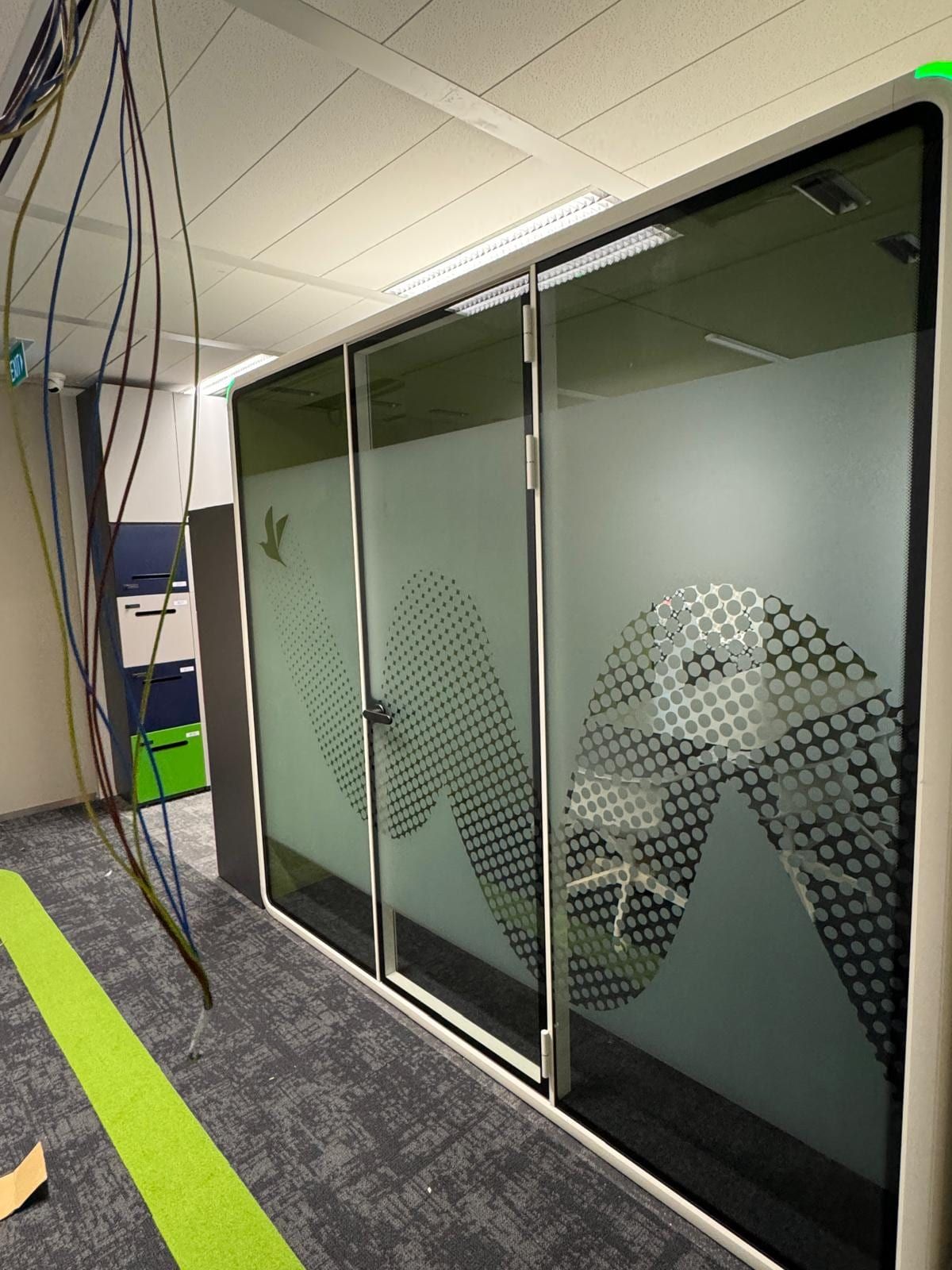 Frosted pattern glass sticker on an office partition — glass stickers for office in Singapore by Garrison Productions