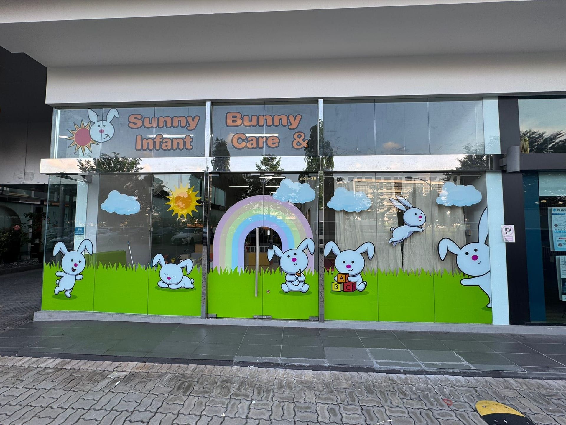 Bunny Care childcare shopfront glass stickers — glass sticker design in Singapore by Garrison Productions