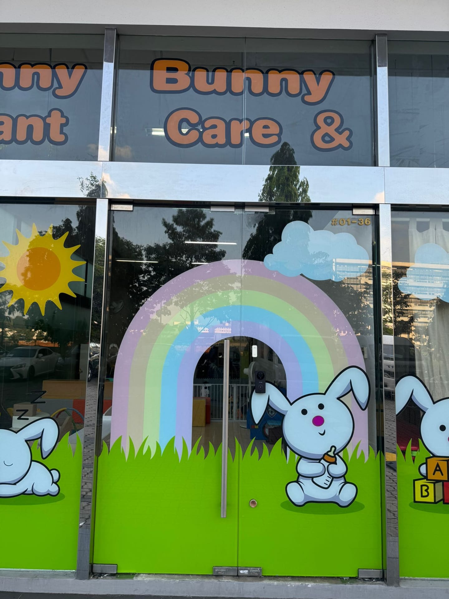 Bunny Care rainbow glass stickers — glass sticker in Singapore by Garrison Productions
