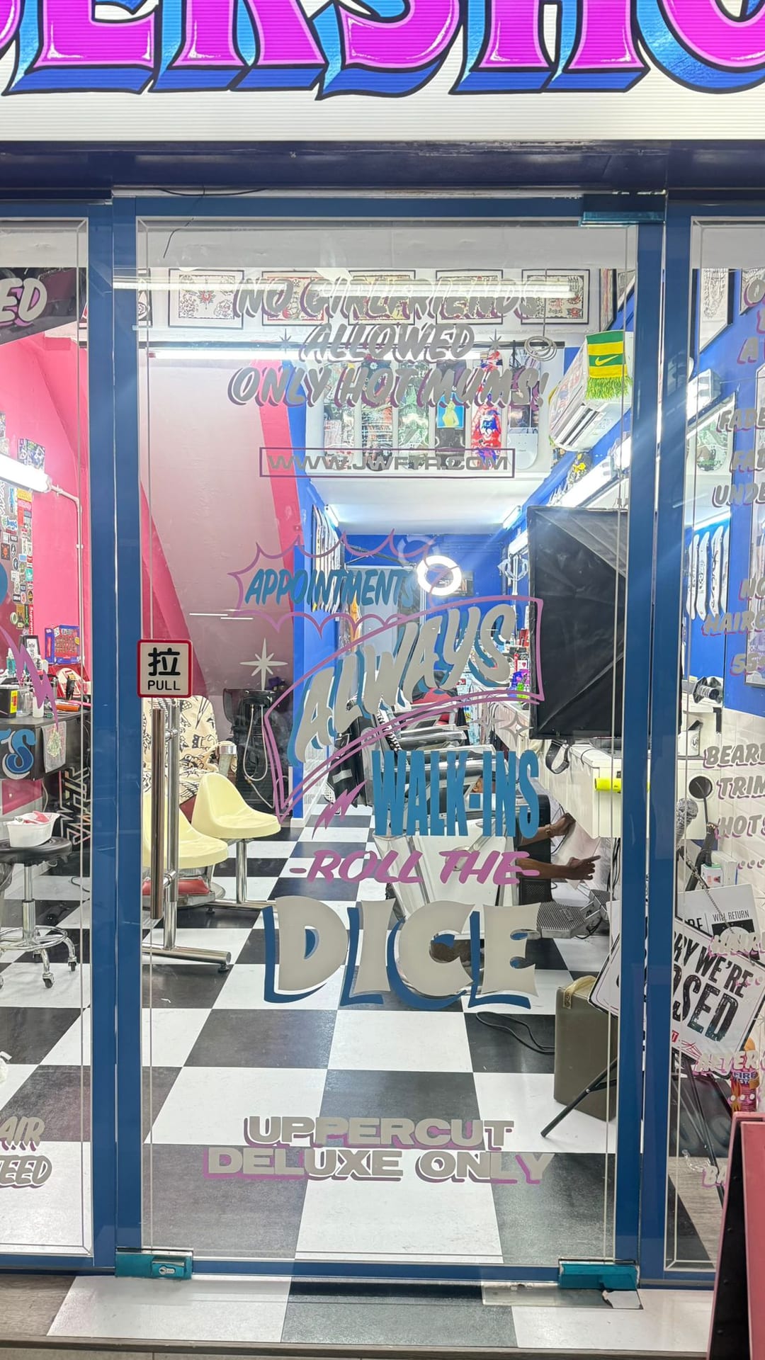 Retail shopfront glass stickers in a mall — glass stickers for windows in Singapore by Garrison Productions