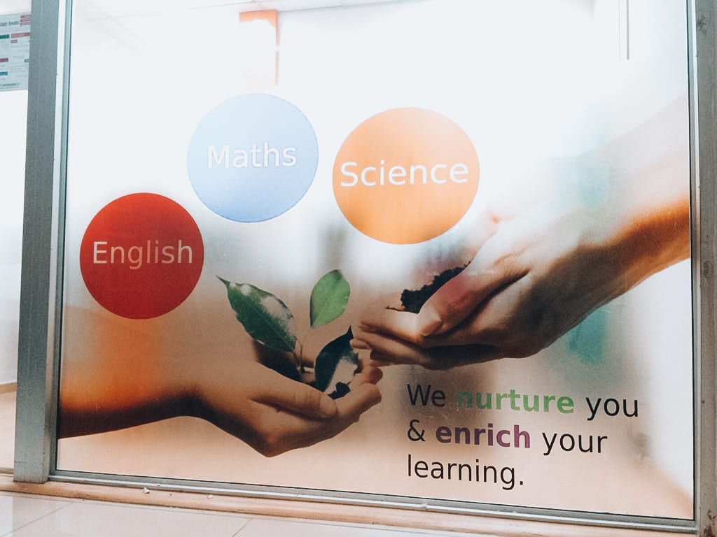 "We nurture you" tuition centre glass sticker — glass sticker printing in Singapore by Garrison Productions