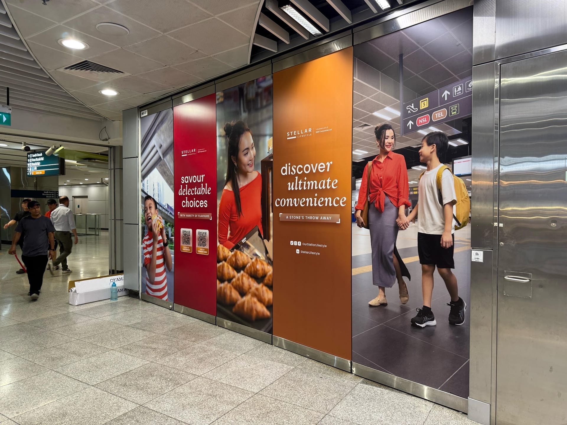"Discover a whole new convenience" retail hoarding in a station — Hoarding Sticker Printing by Garrison Productions, Singapore