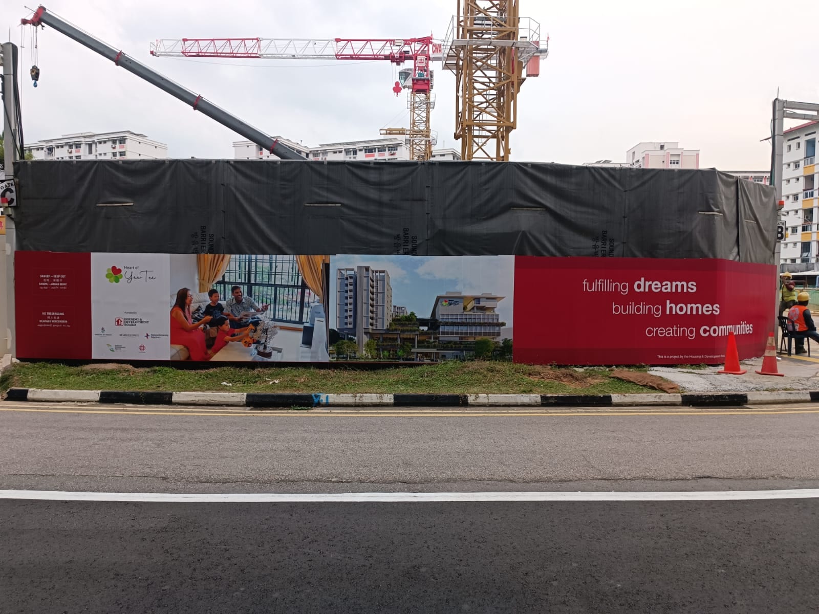 HDB housing project construction hoarding with crane — Hoarding Sticker Printing by Garrison Productions, Singapore