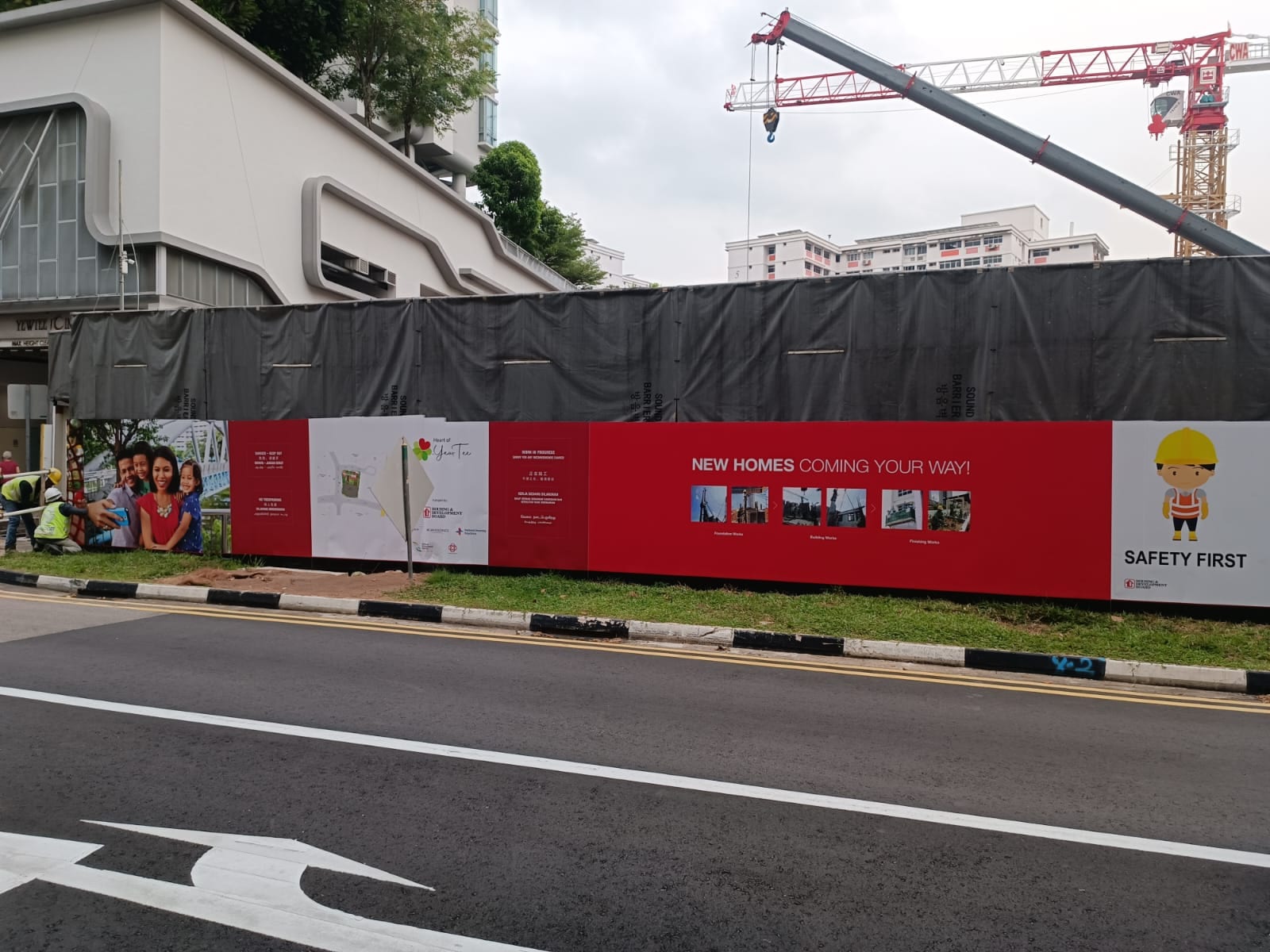 HDB construction site hoarding with safety panels — Hoarding Sticker Printing by Garrison Productions, Singapore