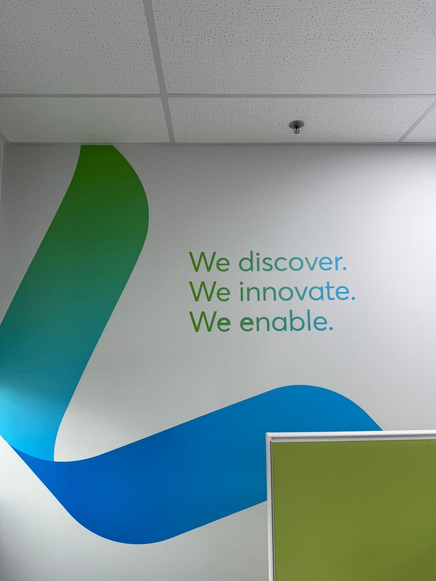 "We discover. We innovate. We enable." office wall mural — Wall Mural by Garrison Productions, Singapore