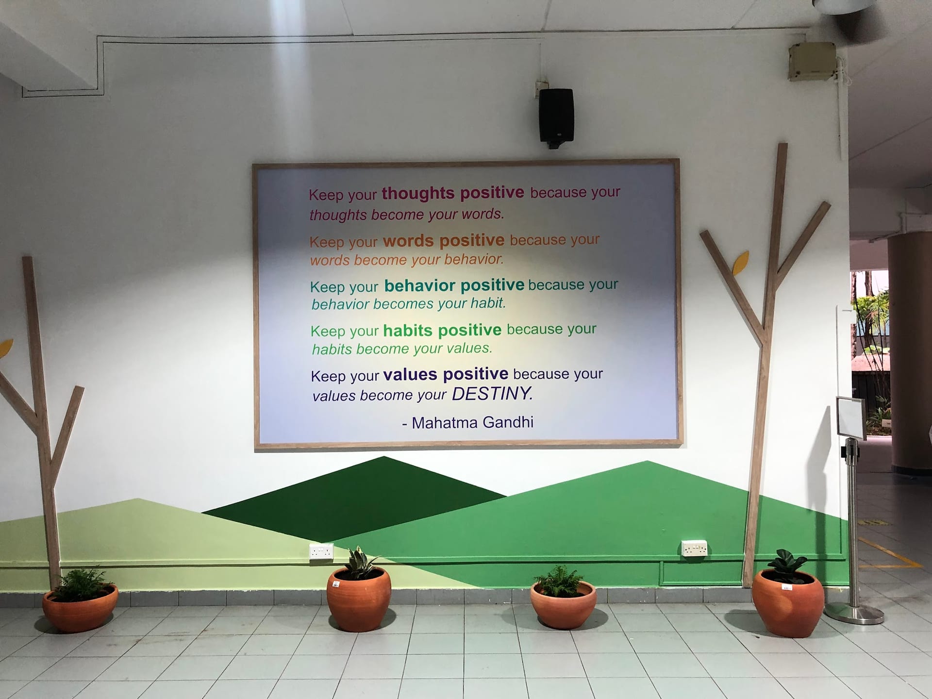 Gandhi quote wall mural with green hills — Wall Mural by Garrison Productions, Singapore