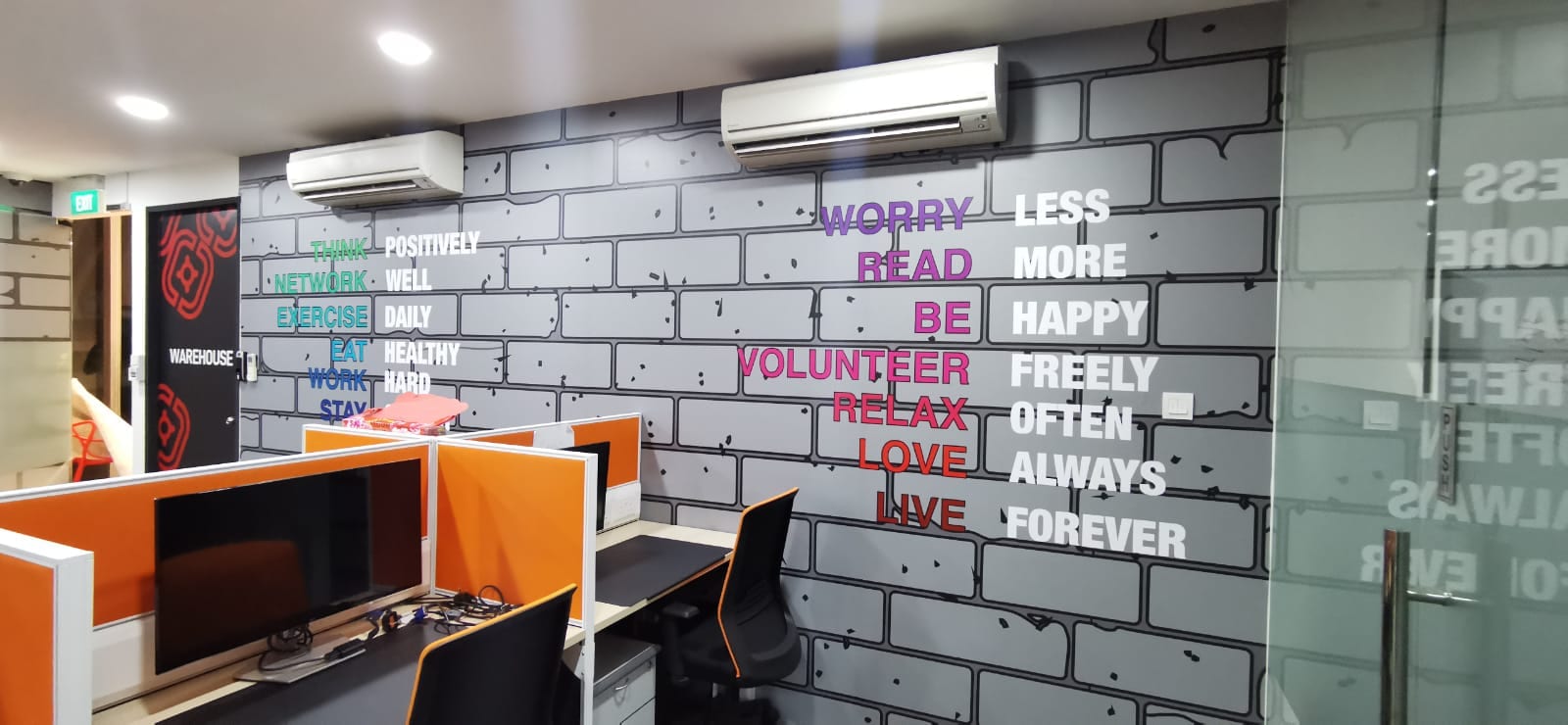 Brick-effect office wall mural with quotes — Wall Mural by Garrison Productions, Singapore