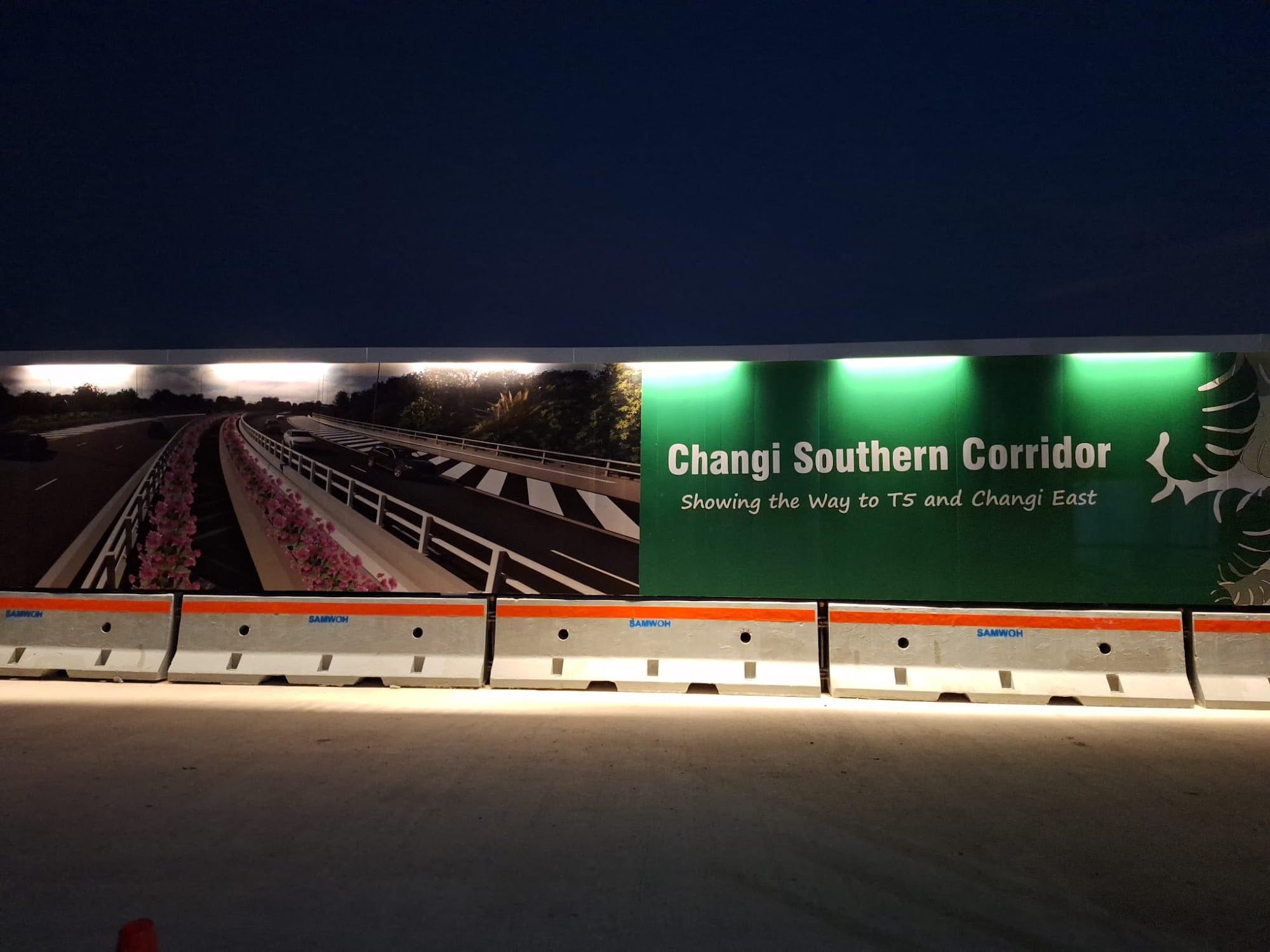 Construction site hoarding on the road to Changi Airport by Garrison Productions, Singapore