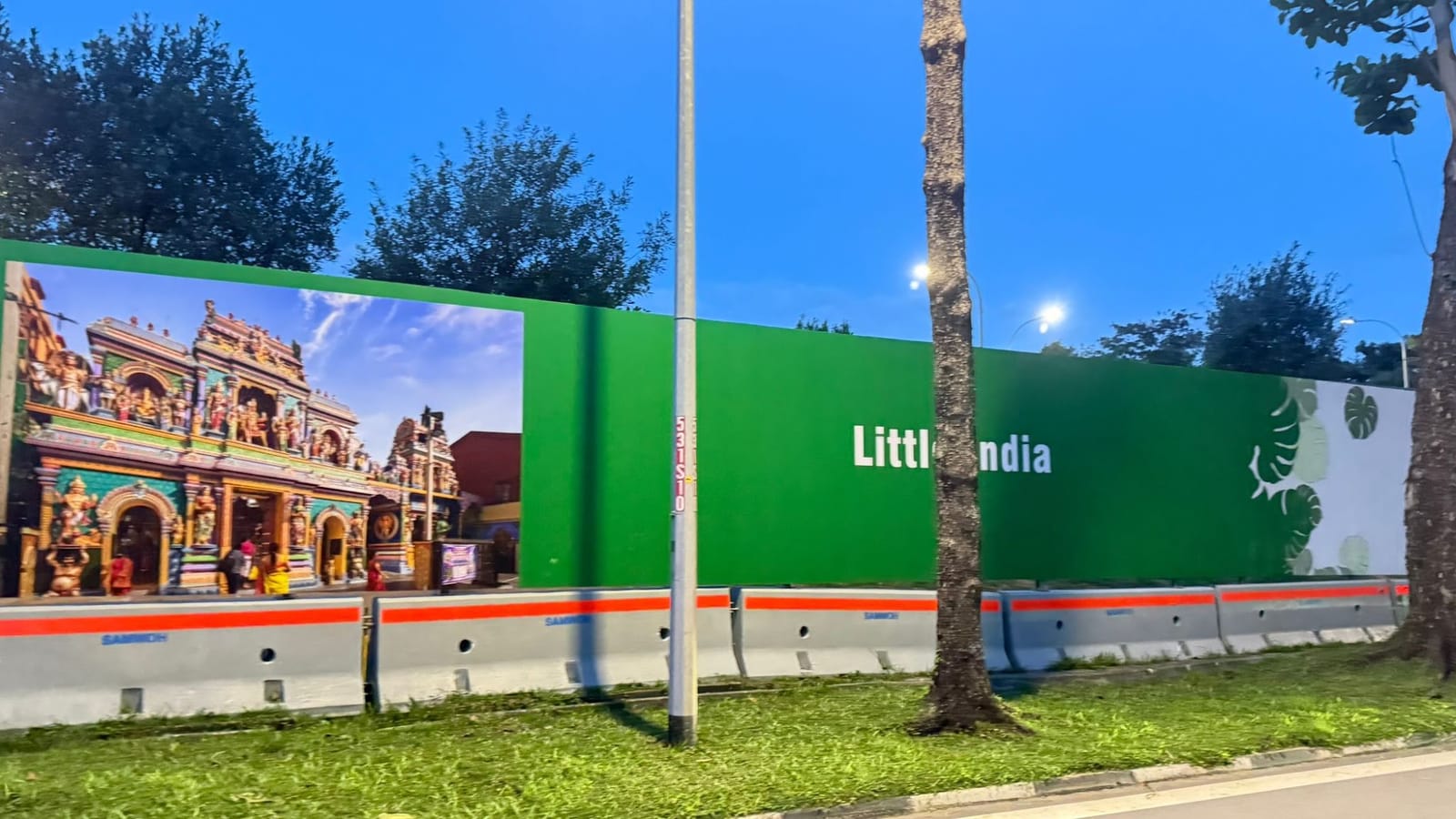 Little India scene on construction hoarding along the road to Changi Airport